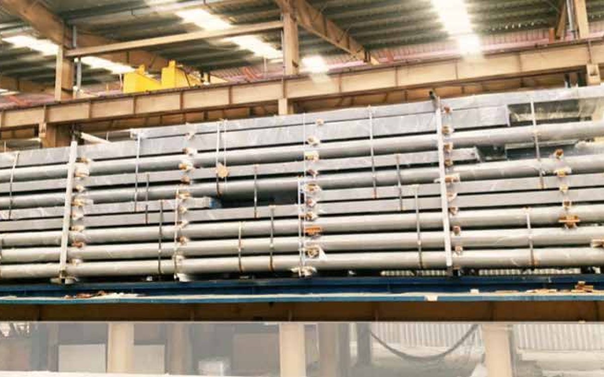 Structural steel loaded in layers on a container support frame