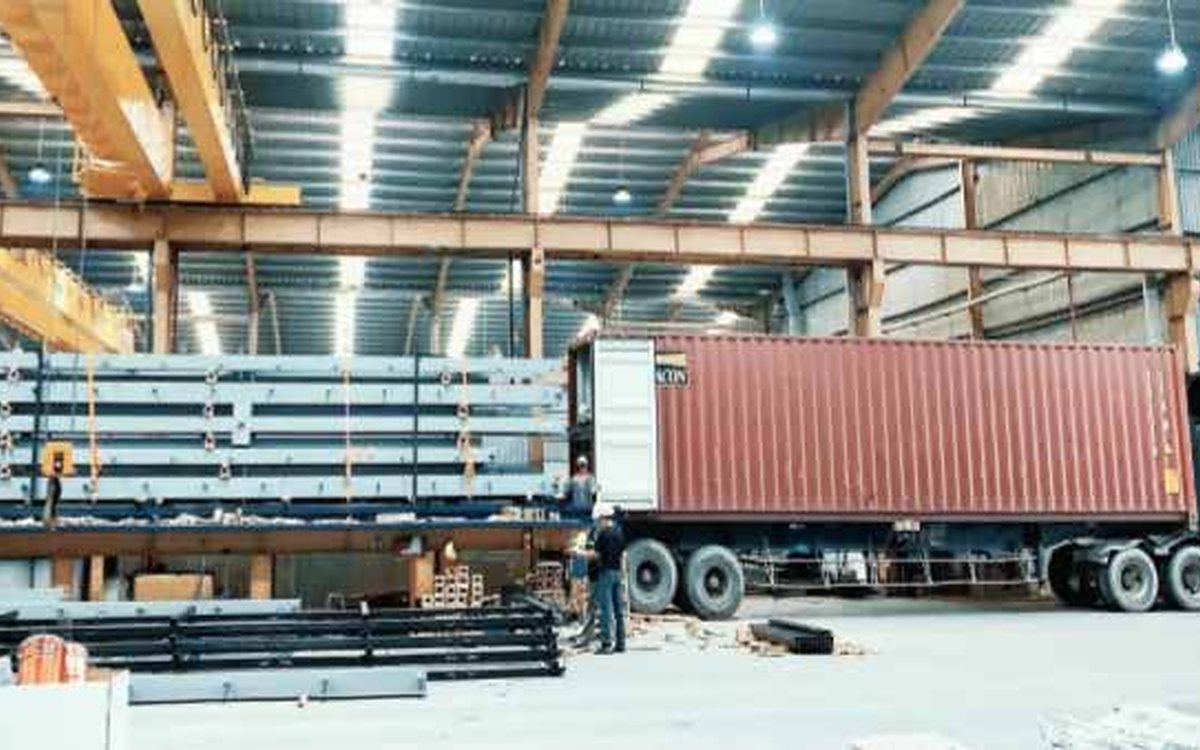 Container truck being loaded at the World Steel factory