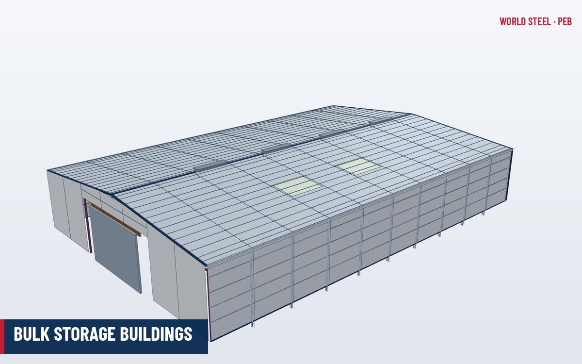 Large clear-span steel bulk storage building with concrete push walls and a ridge conveyor gallery