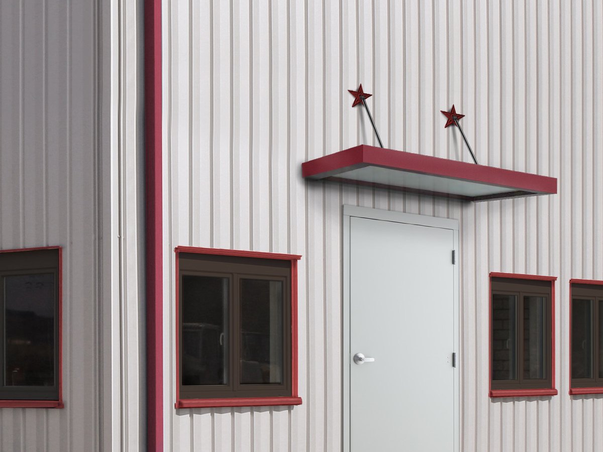 Knock-down walk door with red canopy in a metal building