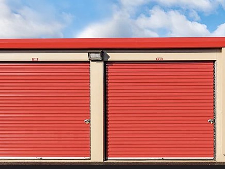 Red roll-up doors on self-storage units