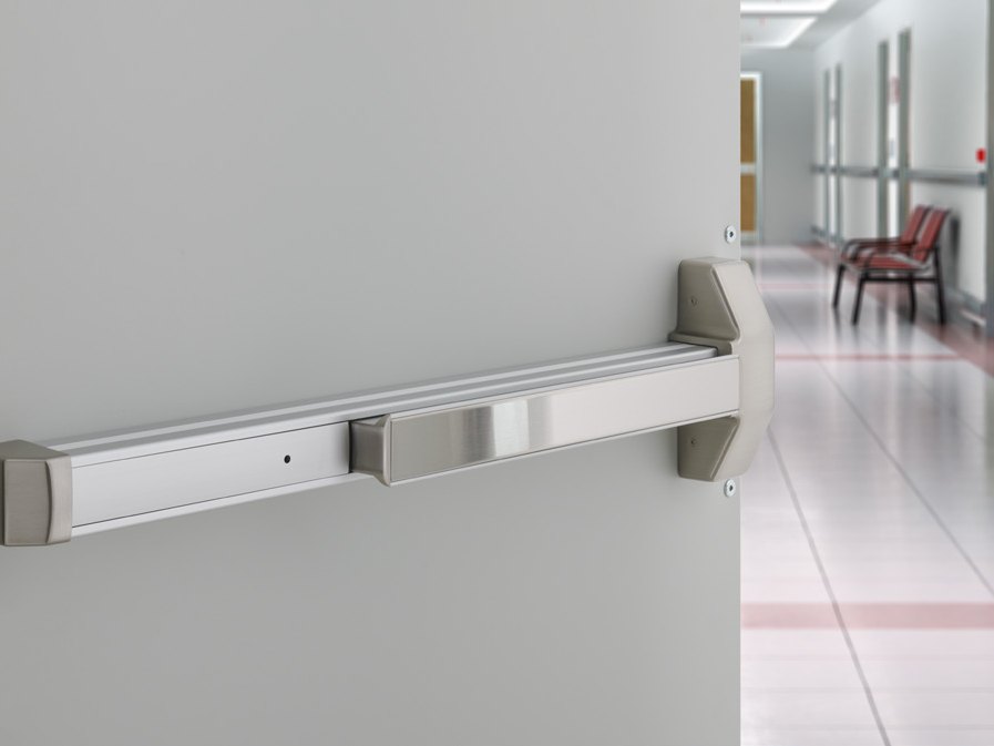 Rim exit device on a corridor door