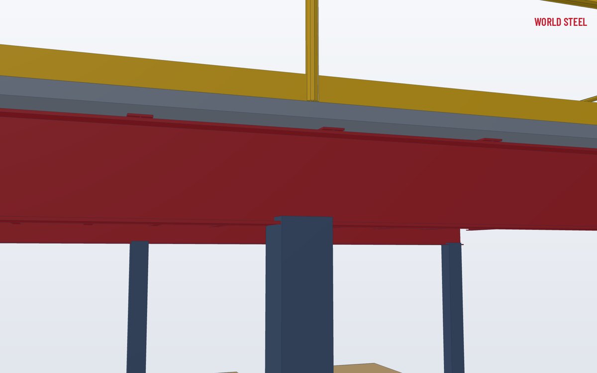 Close-up of a bolted beam-to-column connection supporting a mezzanine deck